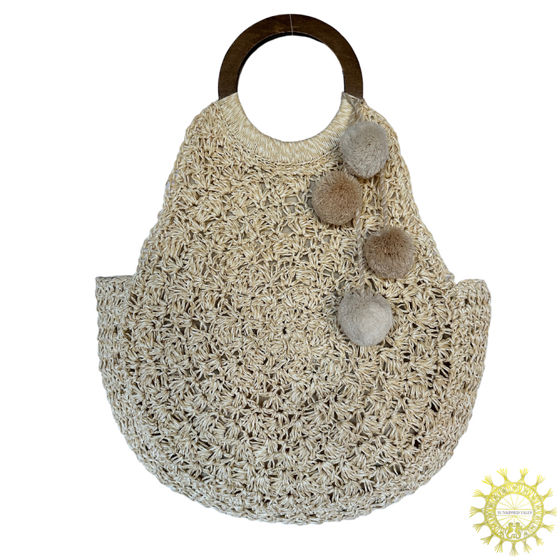 Raffia Crocheted Bag with Double Wooden Handles and Pom Pom trimming in colour Seasand