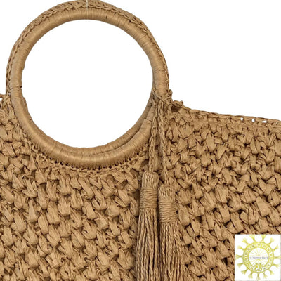 Raffia bag with tassels and ring handles in Suntan