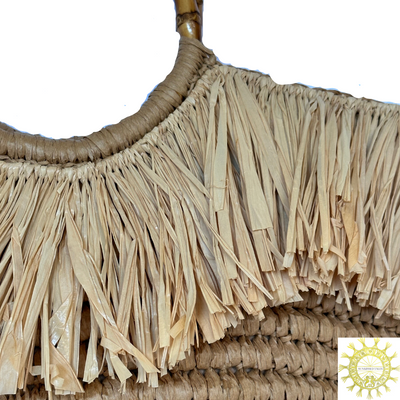 Raffia Bag with straw fringing trim around top of bag and double Bamboo handles