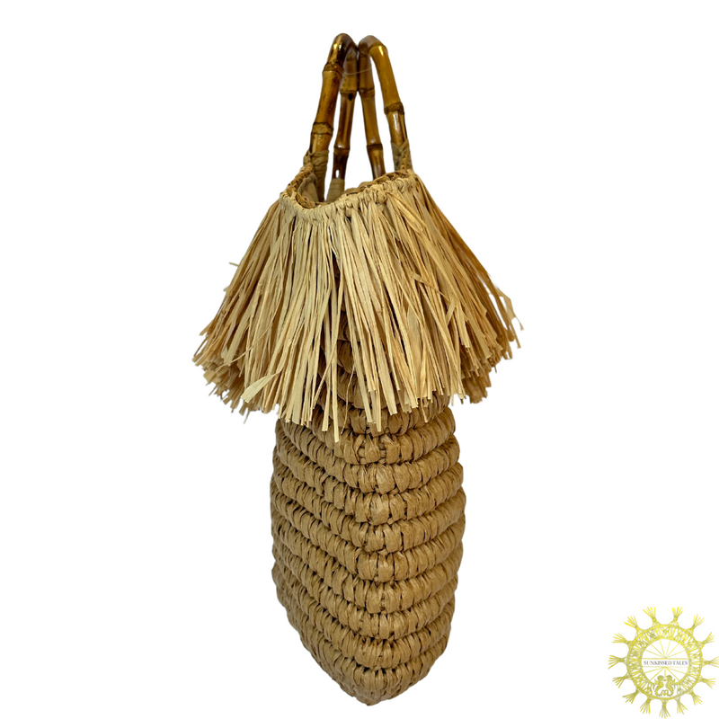 Raffia Bag with straw fringing trim around top of bag and double Bamboo handles